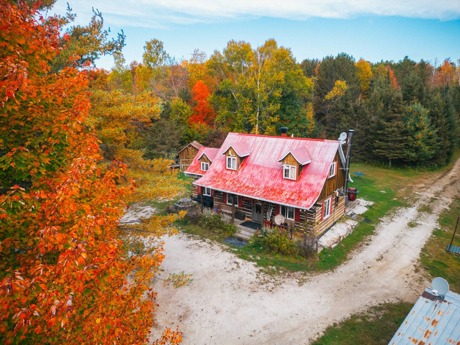 The Boar's Nest farmhouse from above in autumn colours