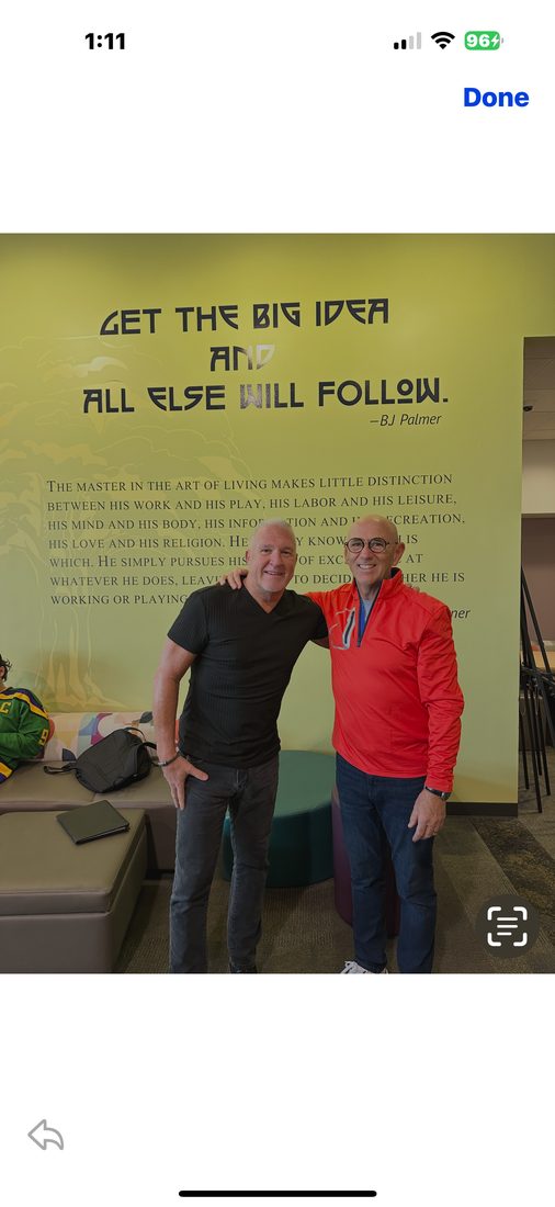 Dr. Kale at the B.J. Palmer wall