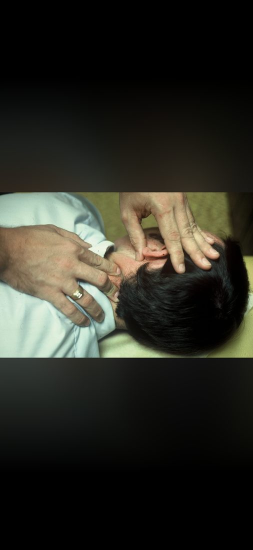 Dr. Kale performing the upper cervical adjustment