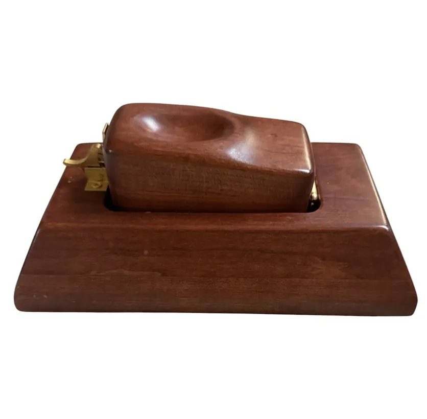 The Kale Speeder Board in solid cherry hardwood with a brass latch