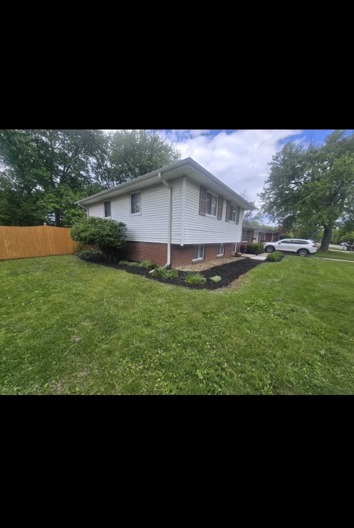 Hoosier Haven landscaping project before and after front bed cleanup