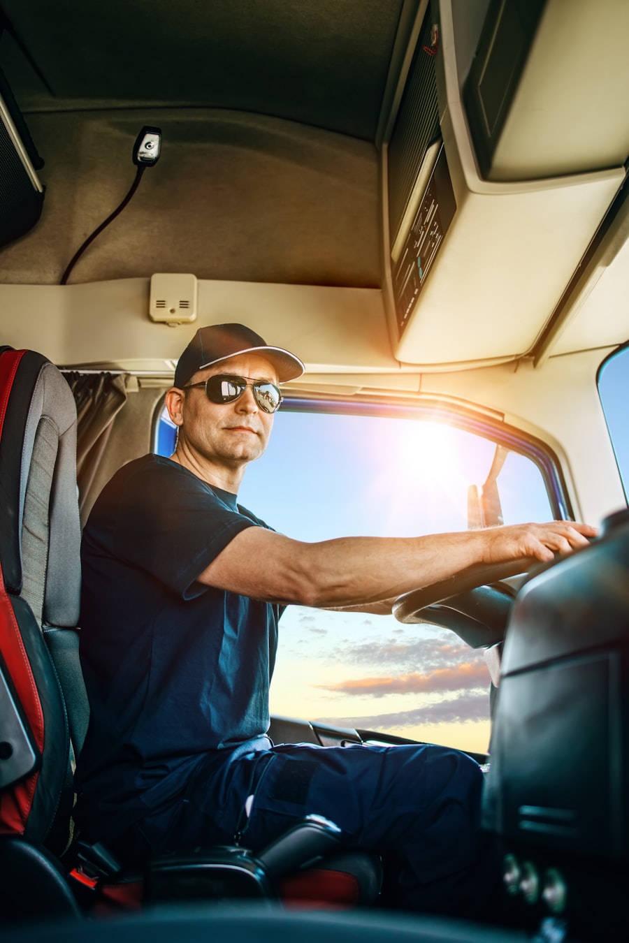 Trucker in the cab behind the steering wheel