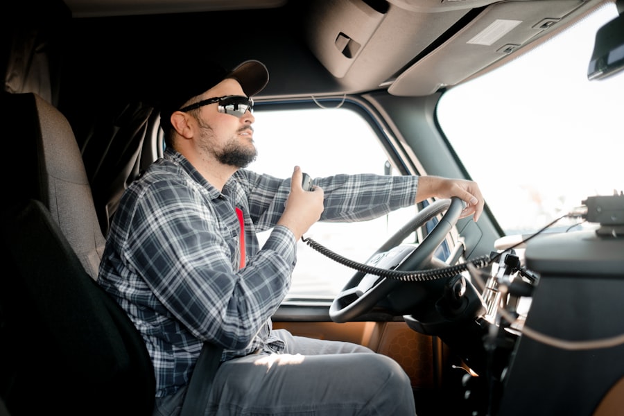 Trucker working recruiting from the cab — phone and laptop