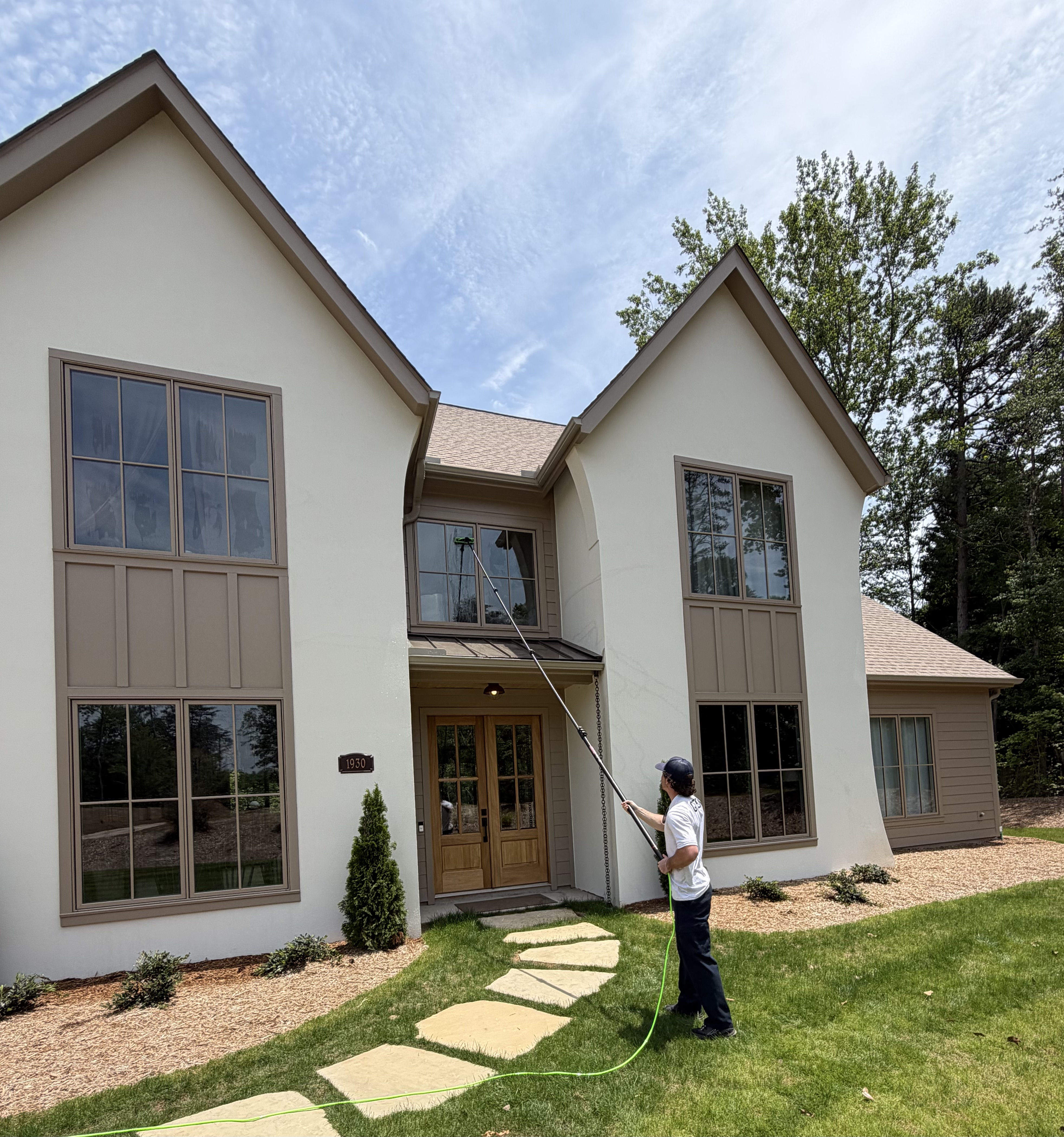 Tango technician cleaning windows at a home in Upstate SC