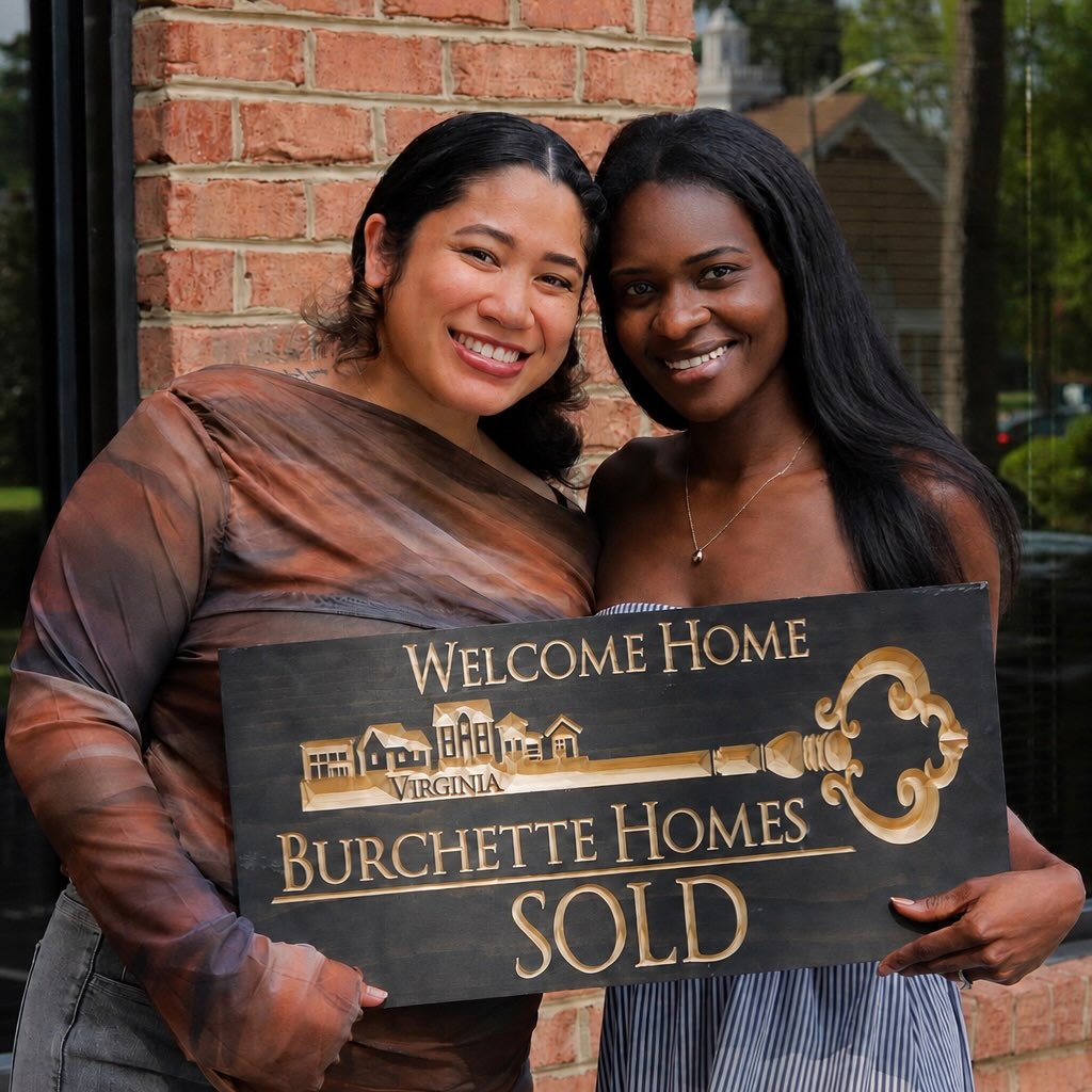 Burchette Homes closing photo with a SOLD sign.