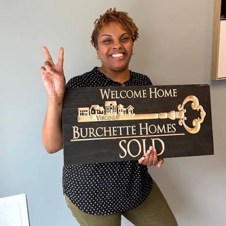 Burchette Homes closing photo with a SOLD sign.