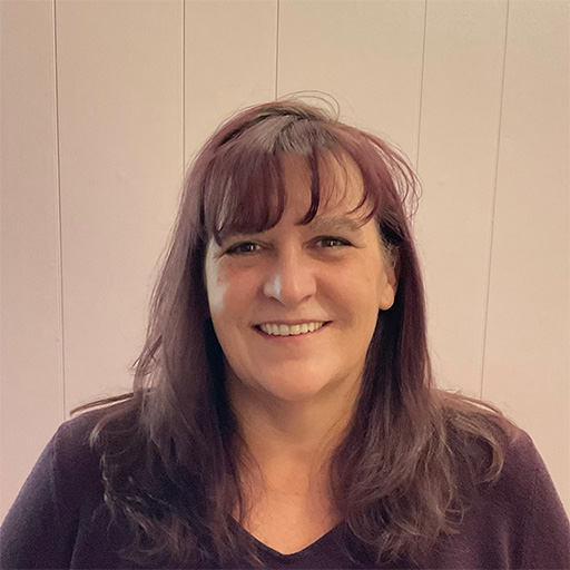 Professional portrait of surface pattern designer Chris Dembinski, creator of botanical wallpaper and textile designs for home interiors.