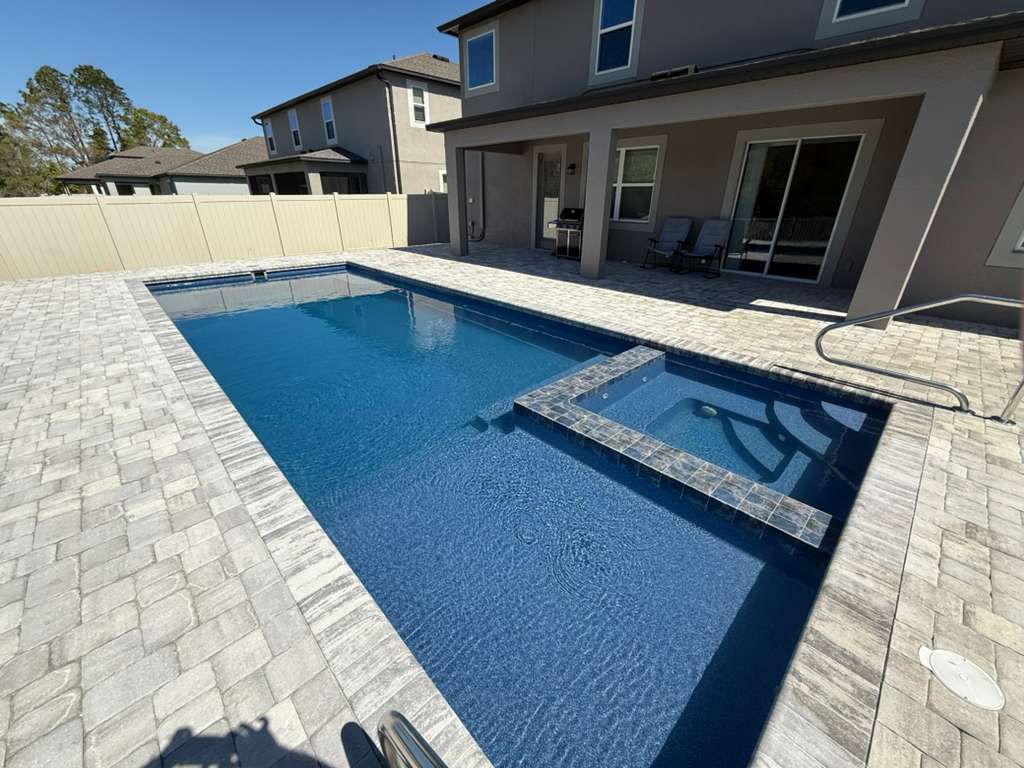 Fiberglass pool with tanning ledge
