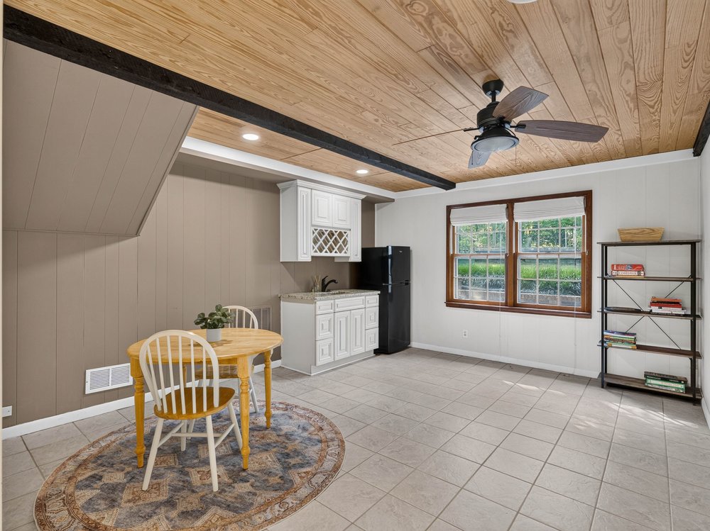 Lower-level kitchenette with refrigerator and sink — 219 Oakwood Ct, Greenville SC