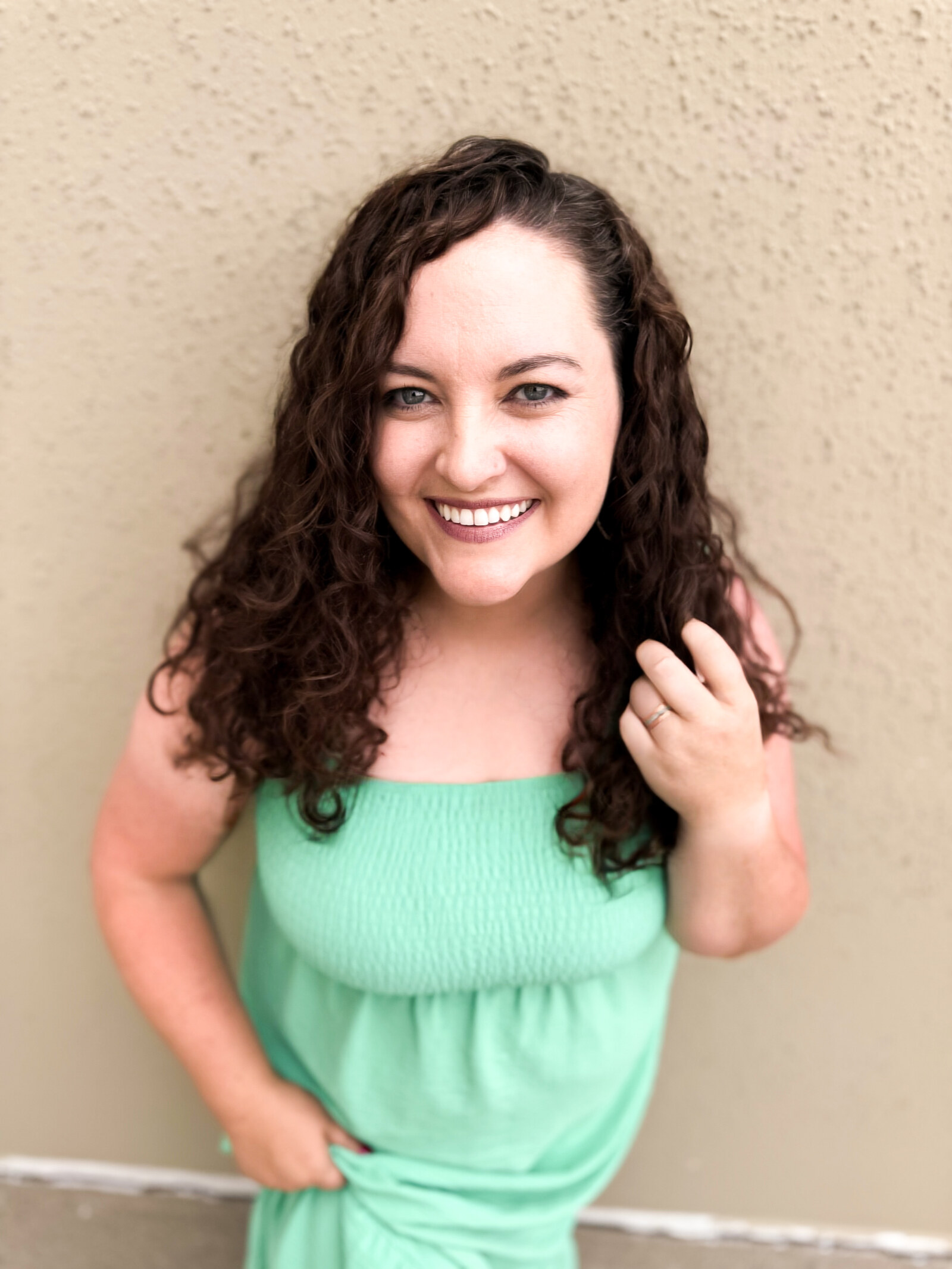 Linette Nye Schmidt, Associate Broker with eXp Realty, in a green dress
