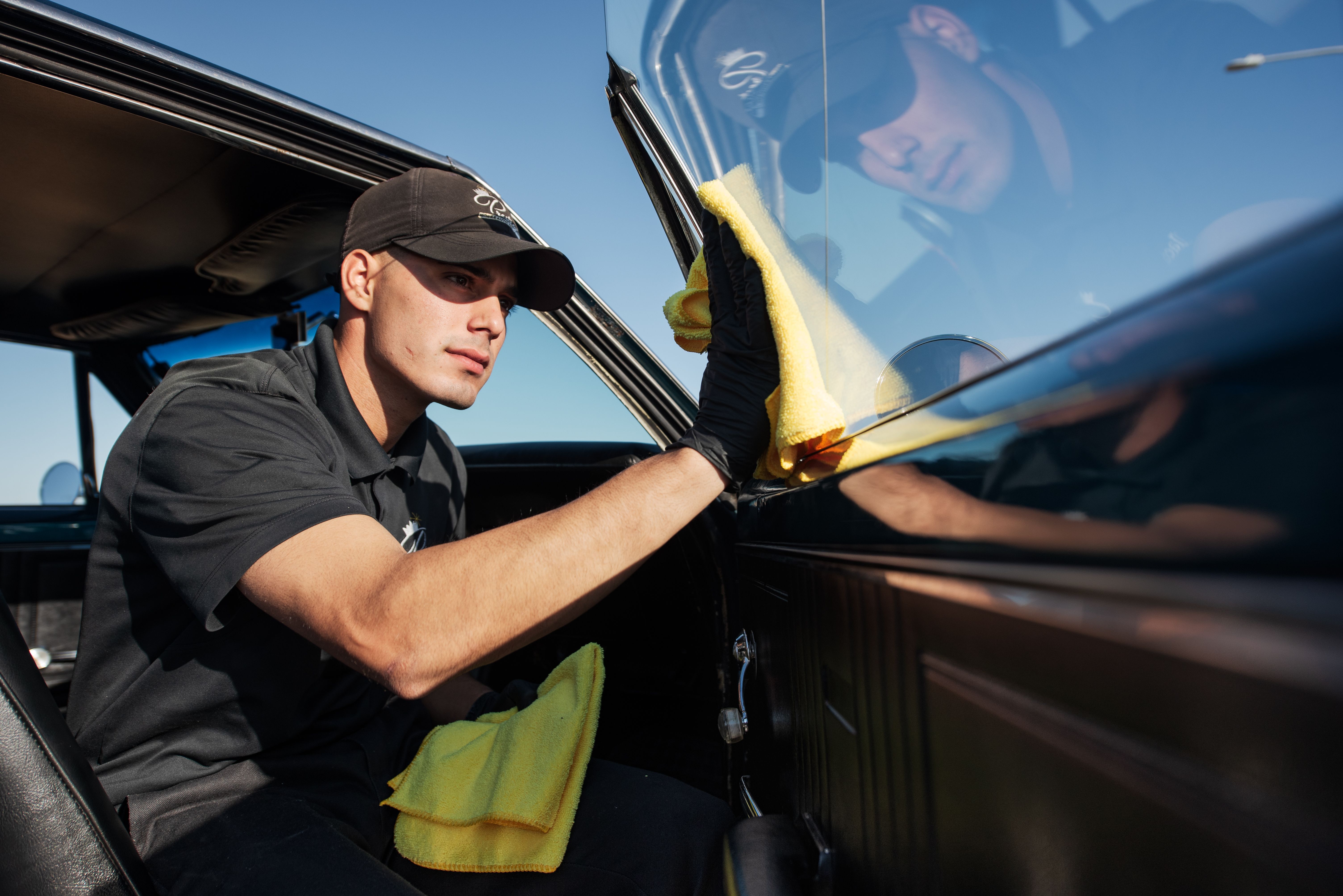 A person wiping the windows.