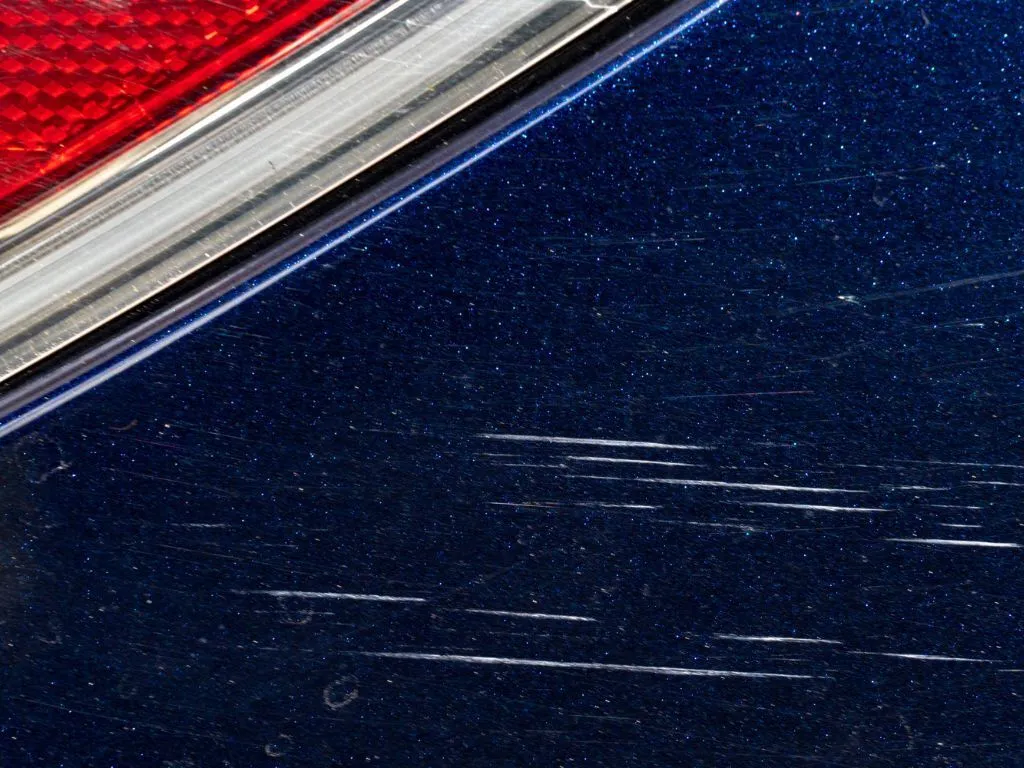 Light scratches on car paint.