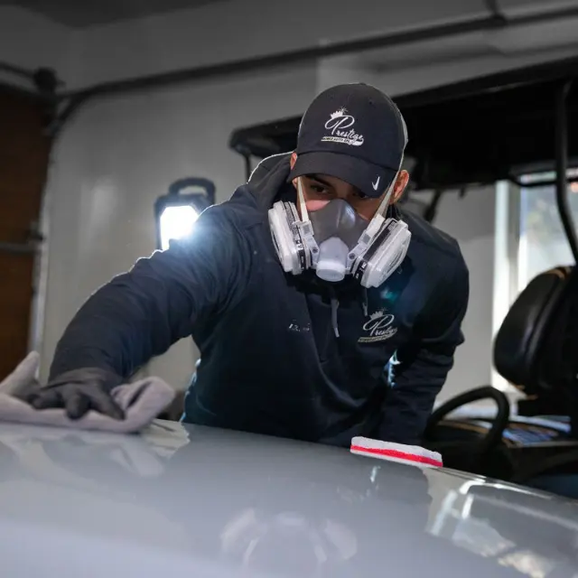 Owner of Prestige placing Ceramic Coating 