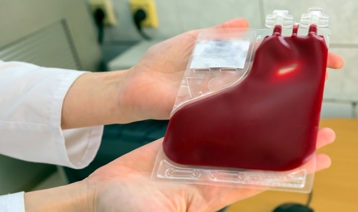 A Photo of reassuring image of cord blood banking—such as a newborn's tiny hand being gently held by a parent—evoking security and future planning.