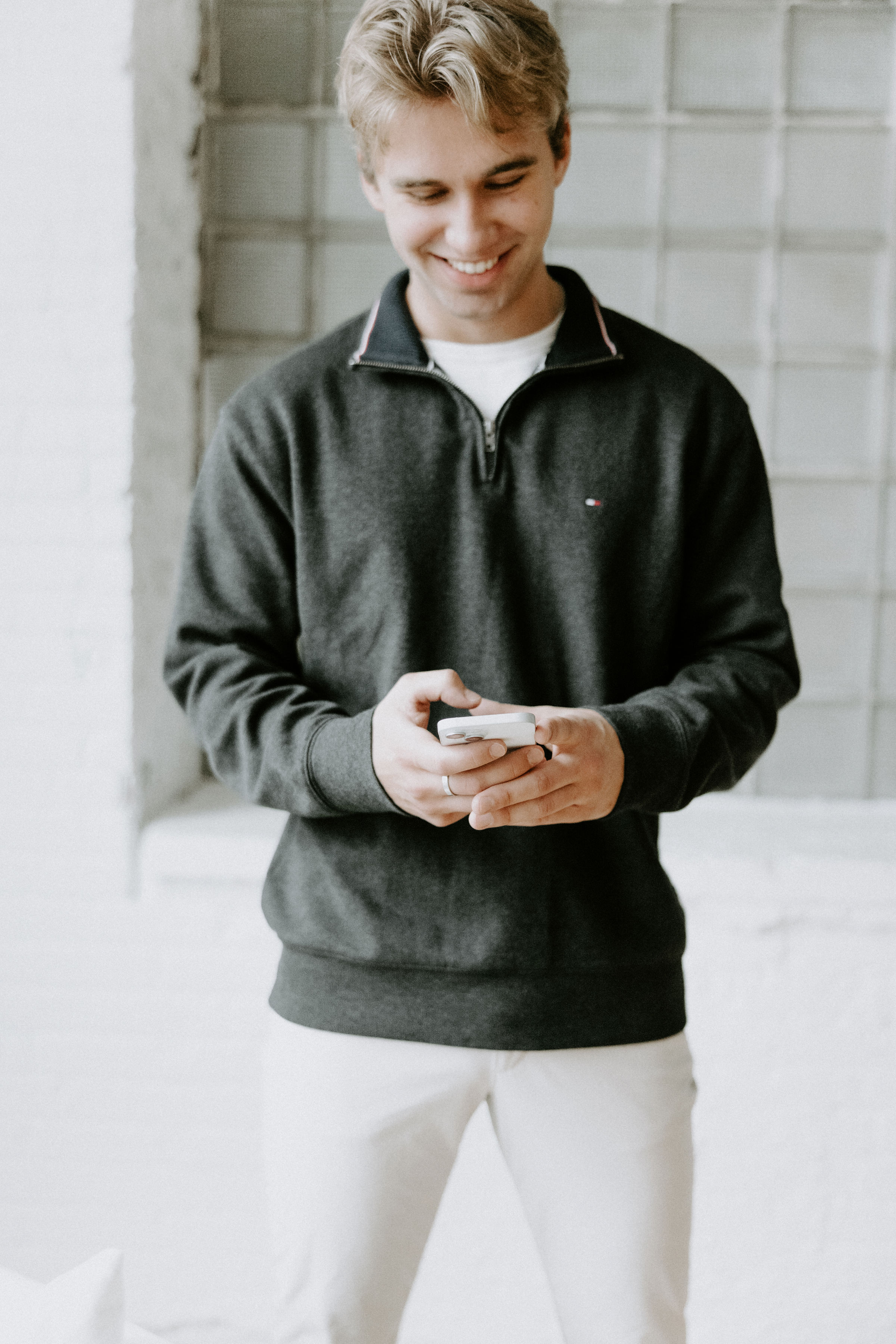 two realtors standing in a white room, laughing