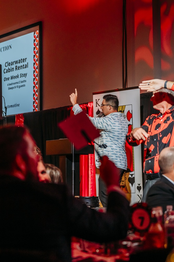 J.T. Morgan taking a bid as bidder paddles go up