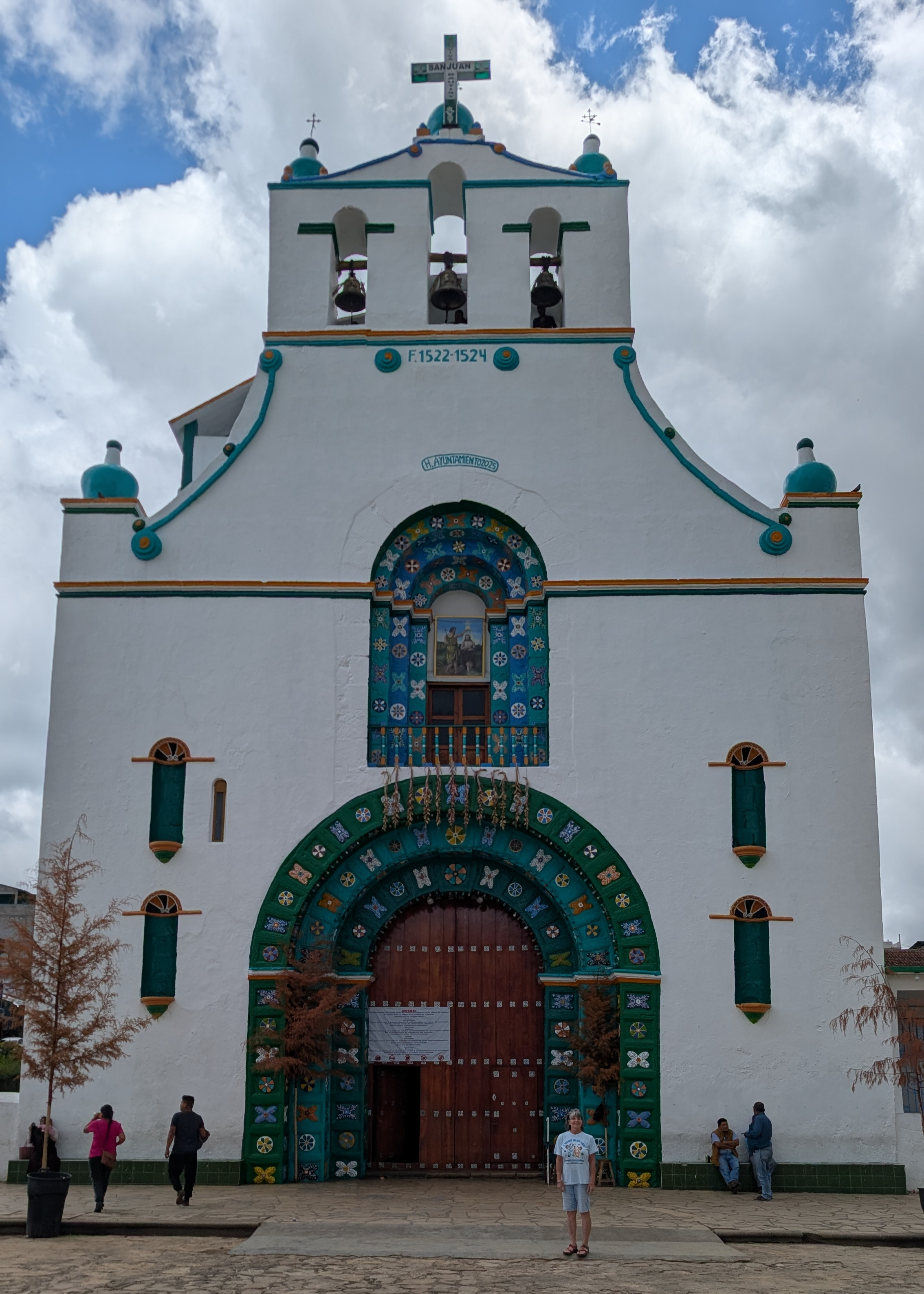 woman standing in front of church in Chamula close to san cristobal de las casas