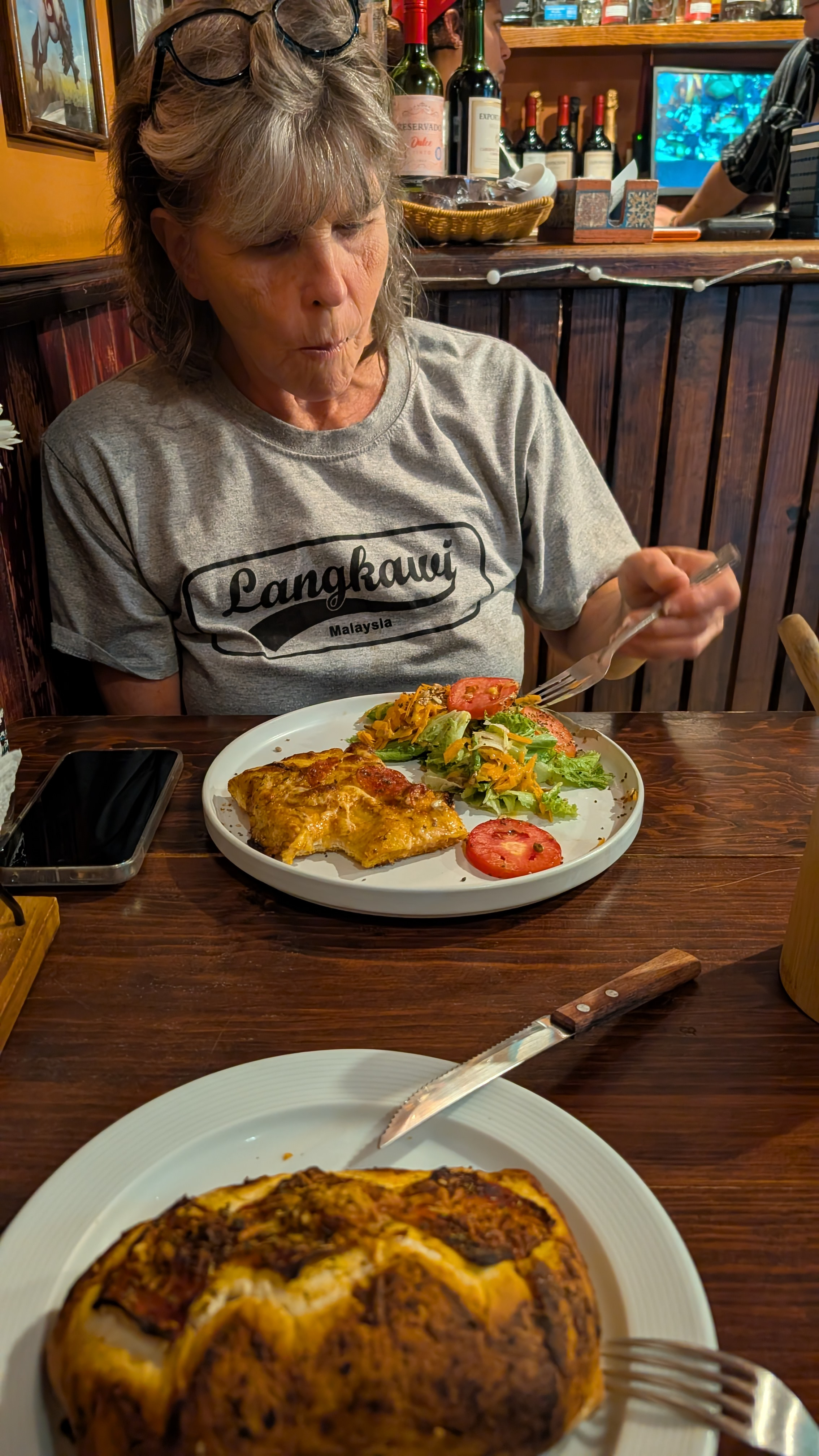 my mother eating food in an argentinian restaurant in san cristobal de las casas, chiapas my mother eating food in an argentinian restaurant in san cristobal de las casas, chiapas