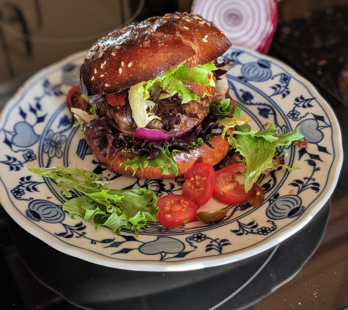 Burger on plate from HUMO restaurant in Valladolid Mexico Burger on plate from HUMO restaurant in Valladolid Mexico