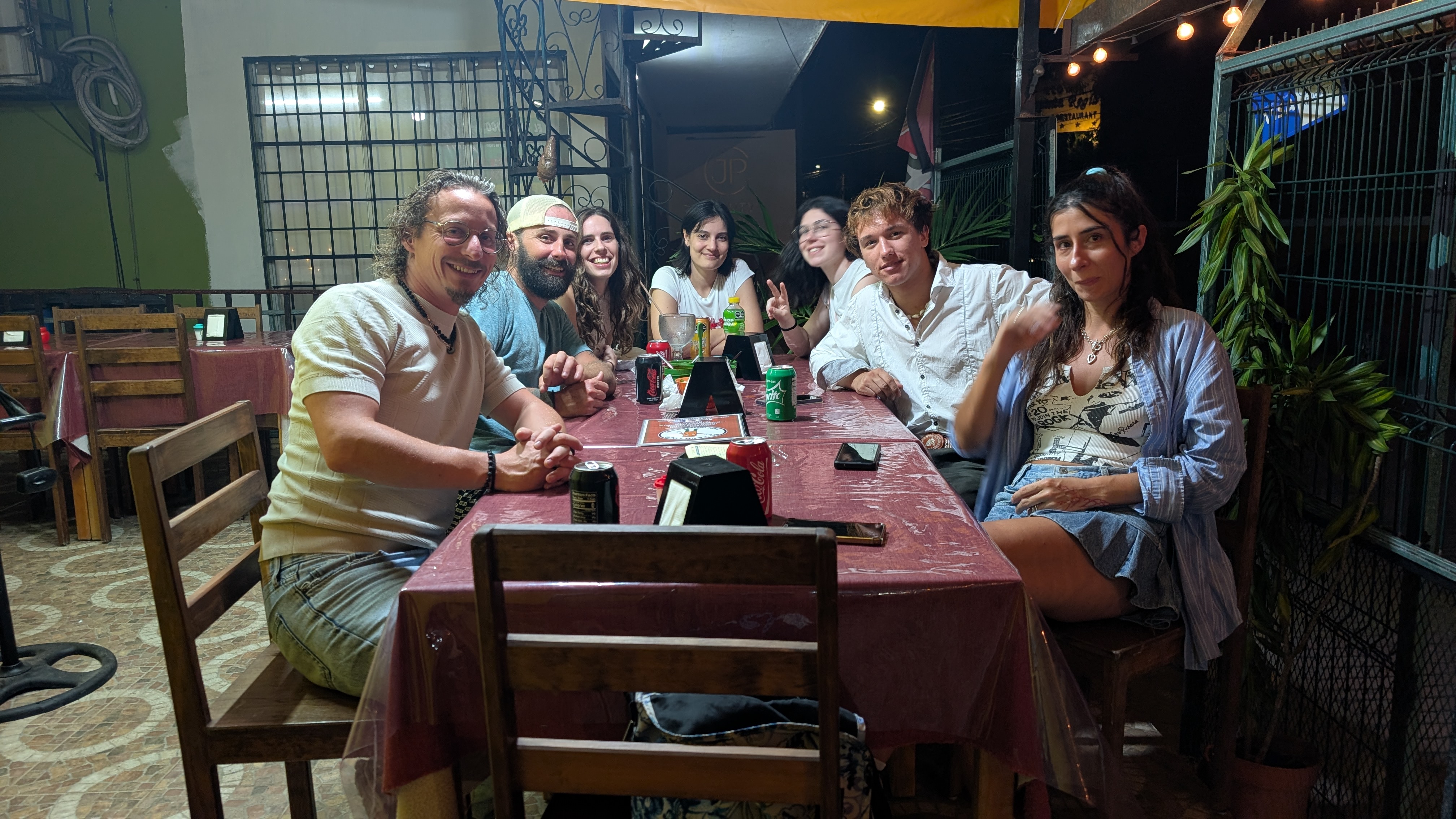 A group of multinational people sitting at a table in a restaurant in valladolid mexico A group of multinational people sitting at a table in a restaurant in valladolid mexico