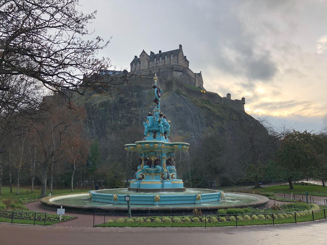 The rose fountain in front of edinburgh castle high up on the hill The rose fountain in front of edinburgh castle high up on the hill
