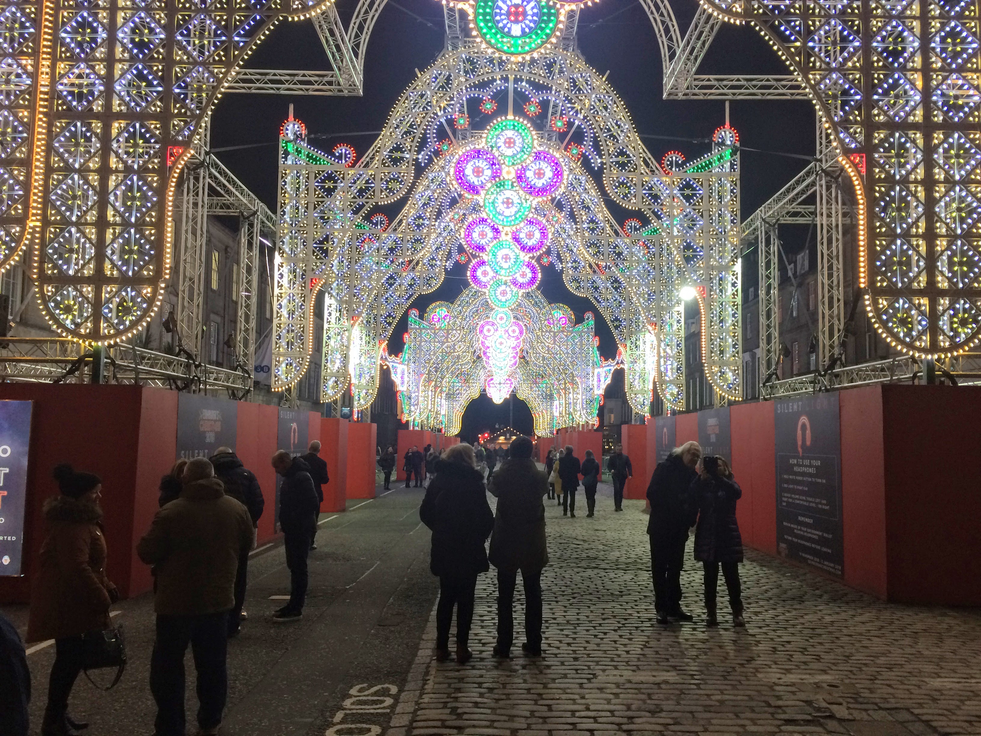 christmas lights on during the edinburgh christmas market in December christmas lights on during the edinburgh christmas market in December