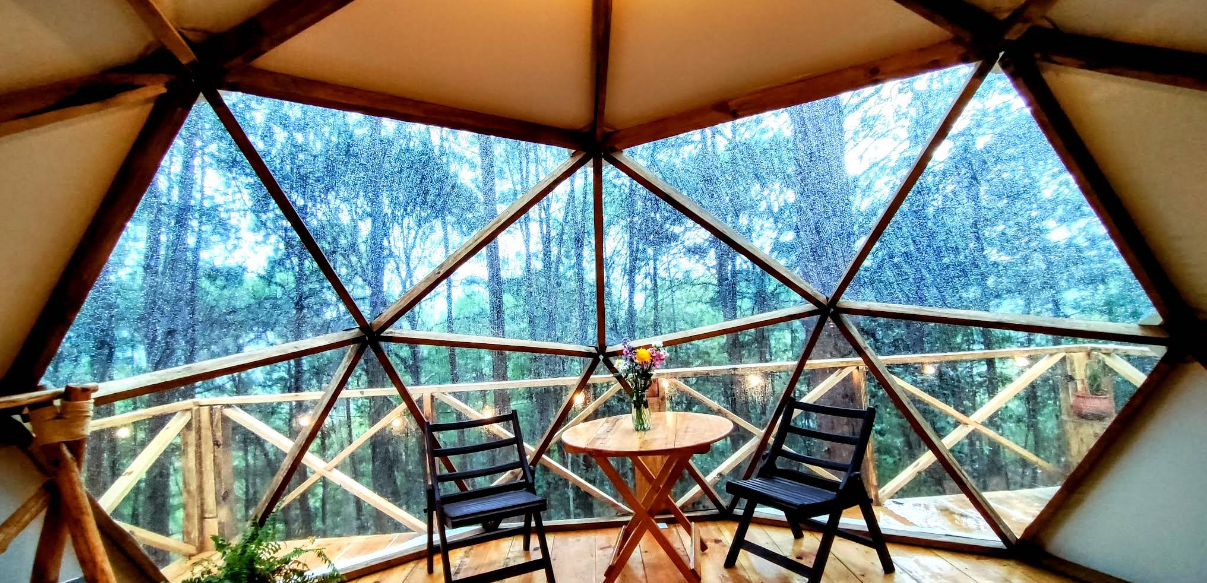Inside of glamping tent with two chairs looking out into the woods in san cristobal de las casas, chiapas at Aura Eco Glamping Inside of glamping tent with two chairs looking out into the woods in san cristobal de las casas, chiapas at Aura Eco Glamping