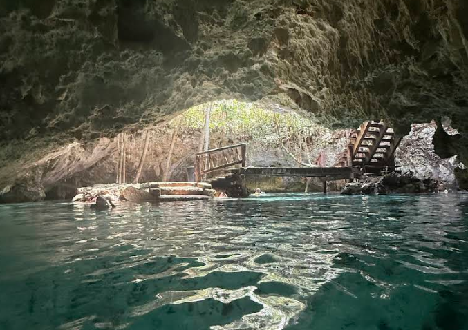 looking at the entrance of the gran cenote in tulum mexico 