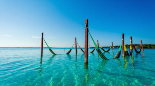 Overwater swing on the Bacalar lagoon, Mexico