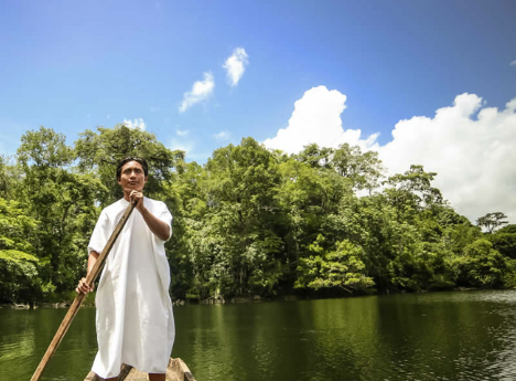 mayan lacandonan on a canoe in the river in chiapas