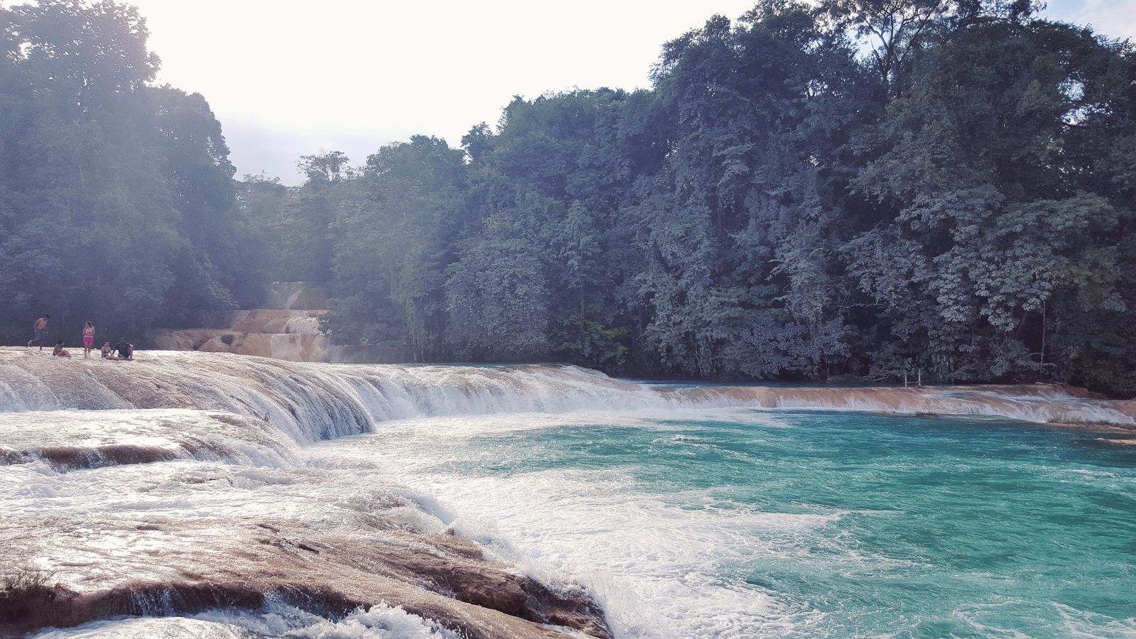 Wide view of the turquoise terraced pools of Cascadas de Agua Azul with jungle on both banks Wide view of the turquoise terraced pools of Cascadas de Agua Azul with jungle on both banks
