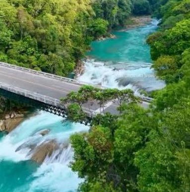 the suspension footbridge over the turquoise Santo Domingo River at Las Nubes, rapids below the suspension footbridge over the turquoise Santo Domingo River at Las Nubes, rapids below