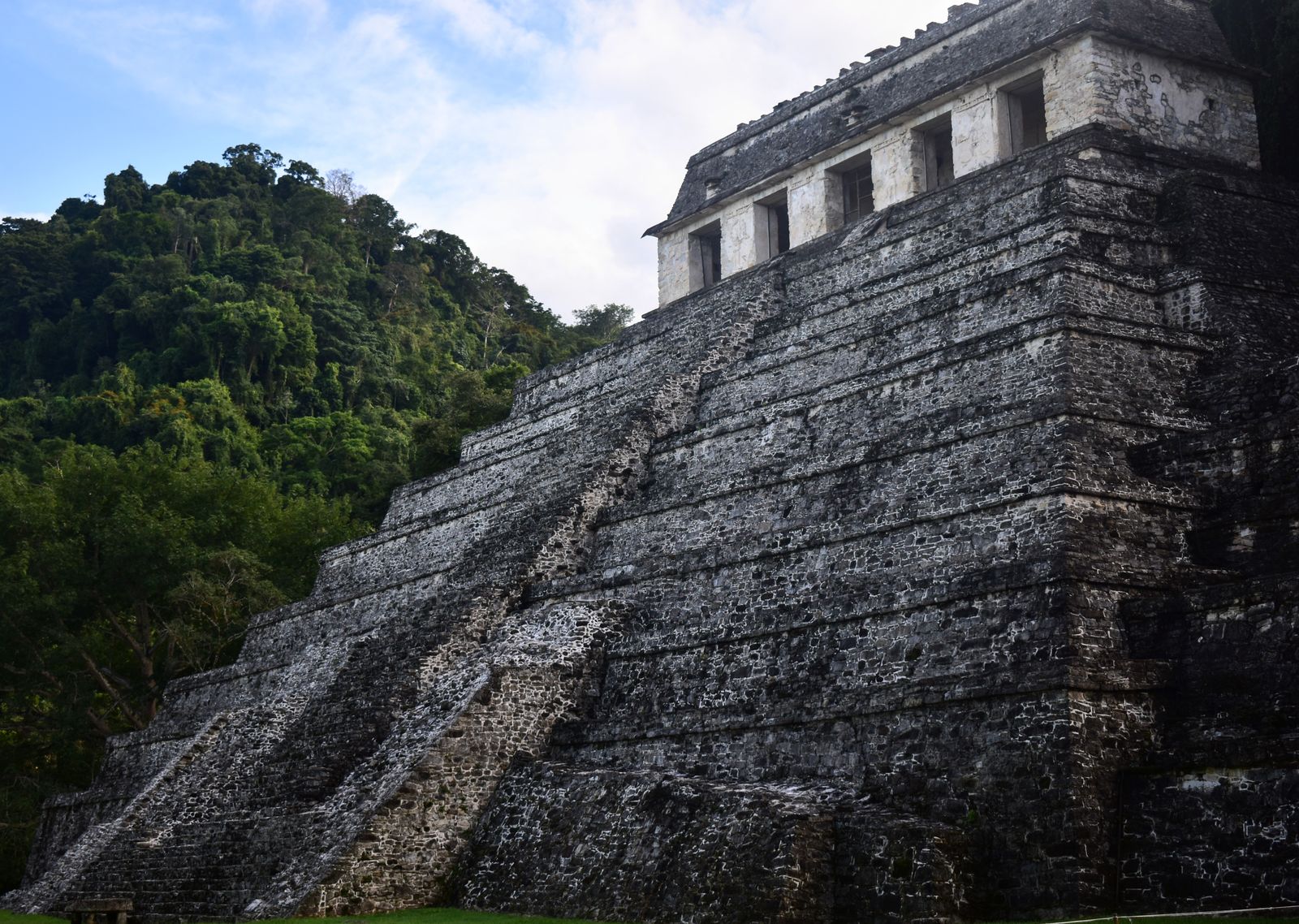 The Temple of the Inscriptions pyramid at Palenque rising from the surrounding jungle The Temple of the Inscriptions pyramid at Palenque rising from the surrounding jungle