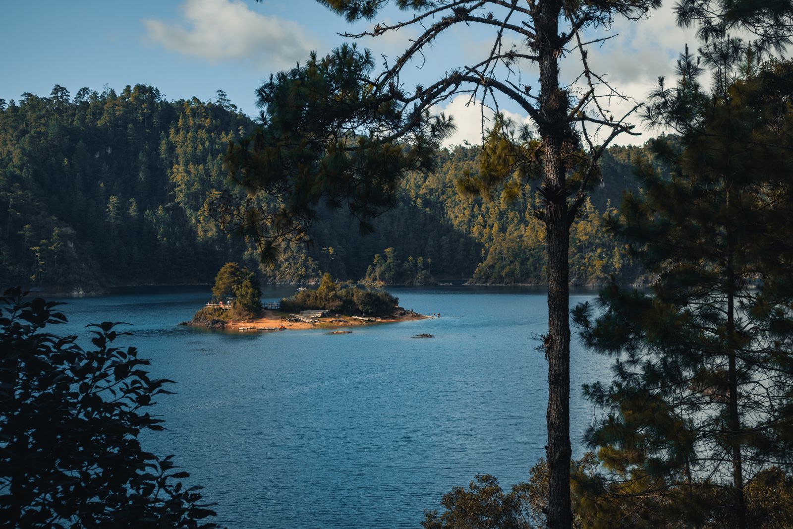 Deep blue Lake Pojoj surrounded by pine forest at Lagos de Montebello National Park, Chiapas