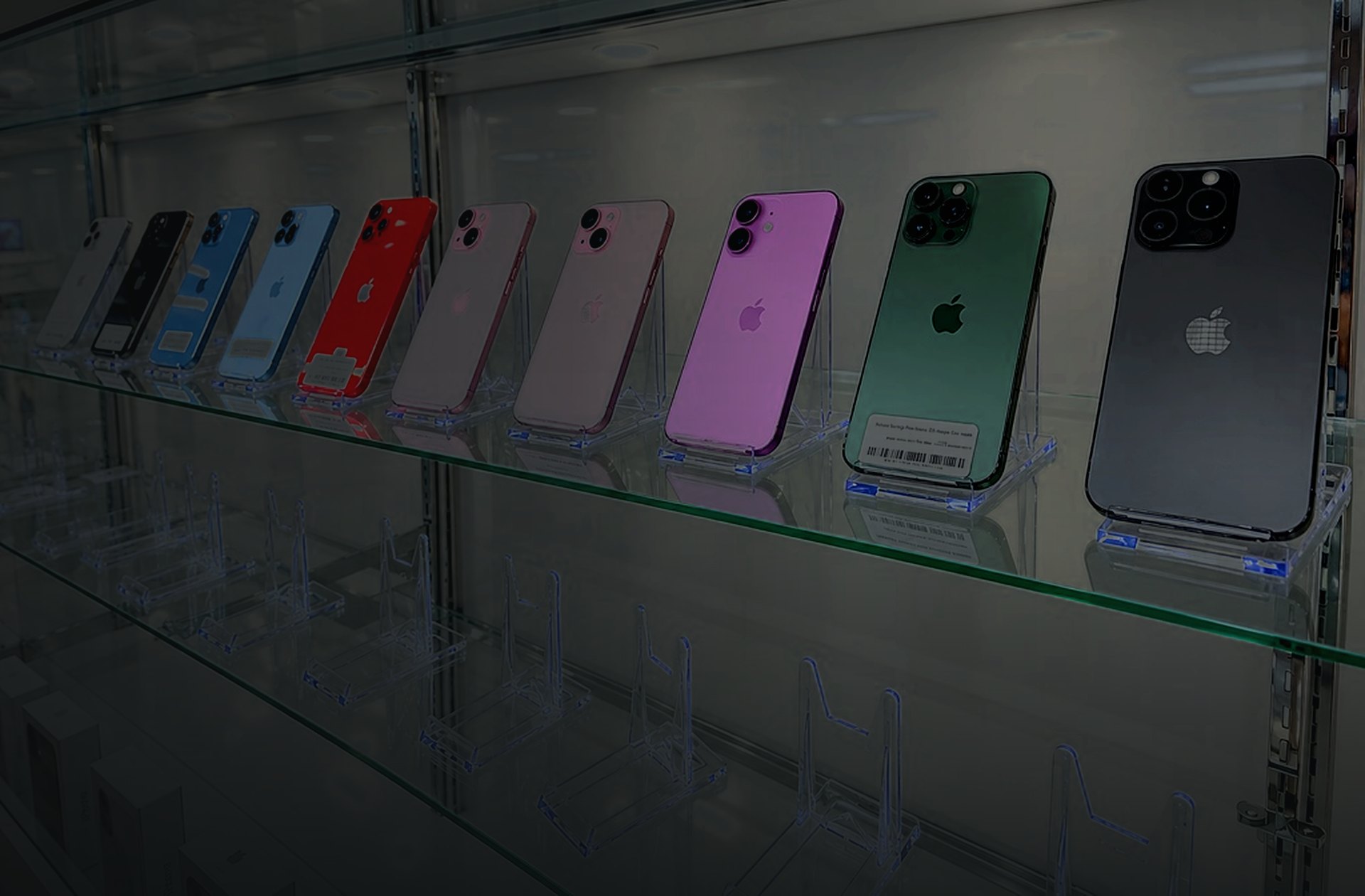 iPhones in every color on the glass shelf at Smart Phone Fix on 66th Street North, St. Petersburg.