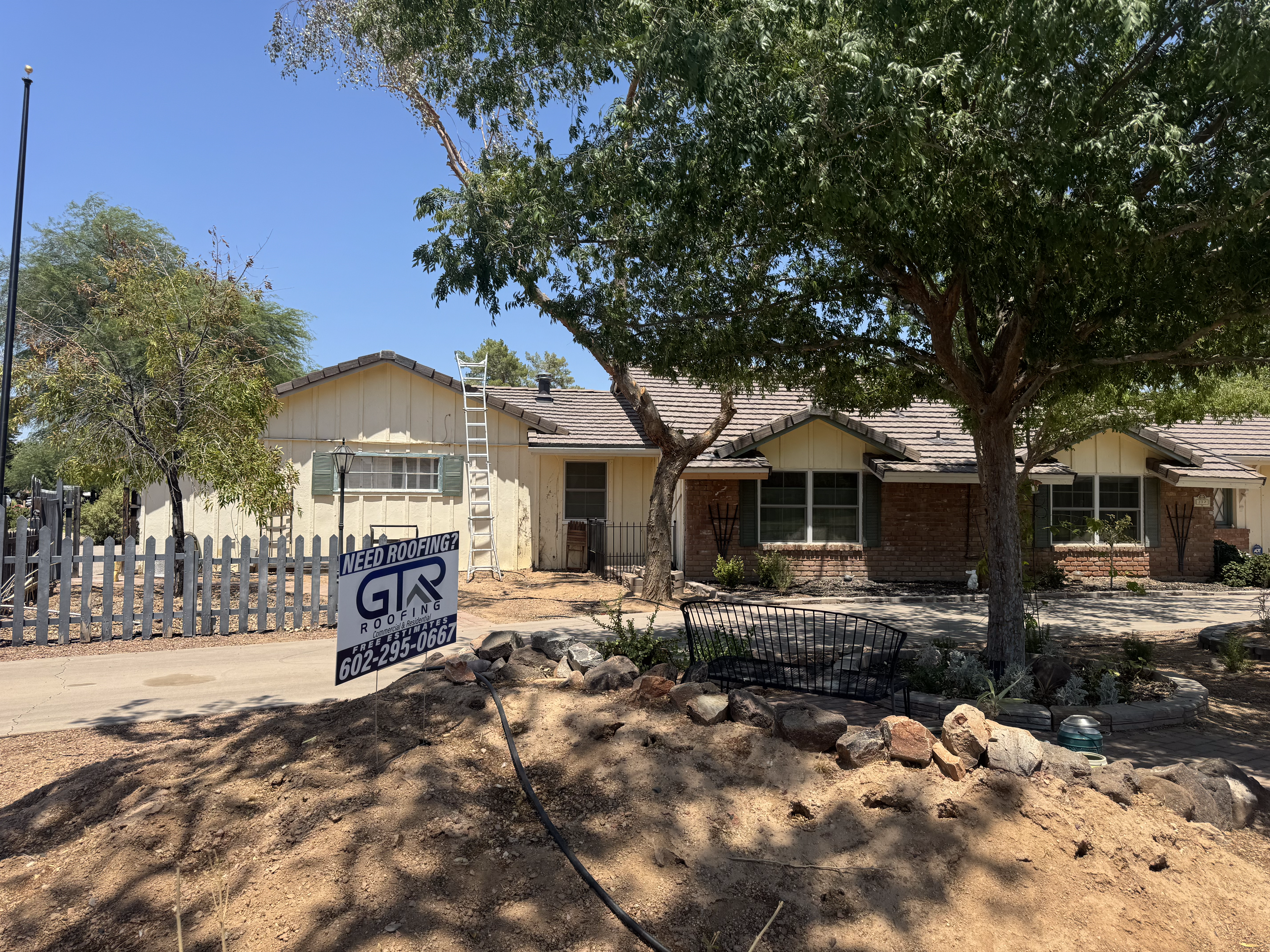GTR Roofing crew completing residential roof tear-off in Phoenix Arizona