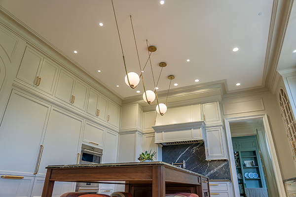 Layered lighting design in a warm Greater Cincinnati kitchen renovation.