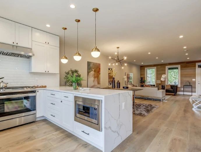 Open concept kitchen remodel with seamless flow between kitchen and living space, featuring a large island in Elmsford NY.