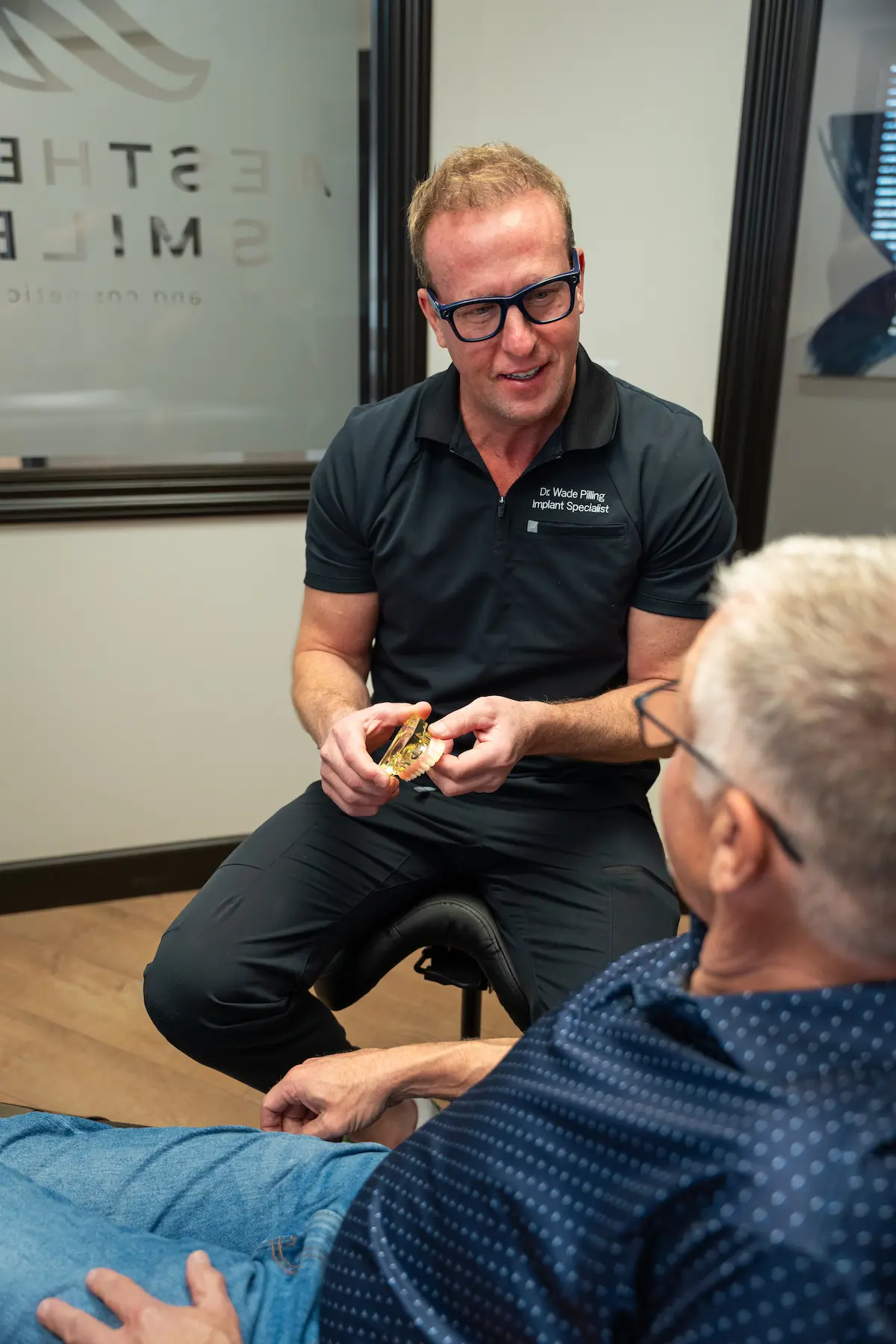 Dr. Pilling talking with a patient during a consult