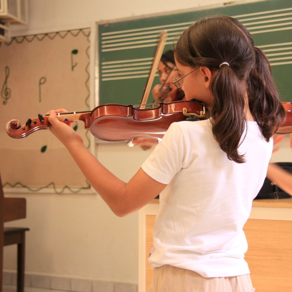 Students performing music through Melody Universe