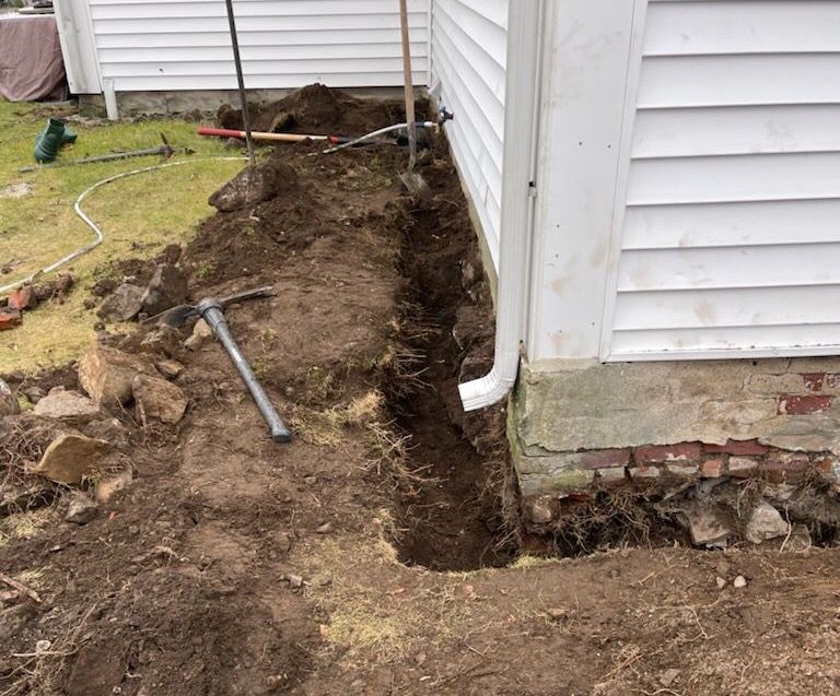 Yard regrading for drainage Boston MA