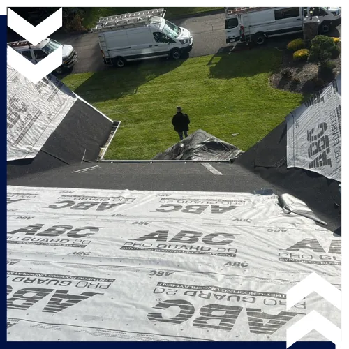 Homeowner receiving new roof installation in New City, NY with durable materials