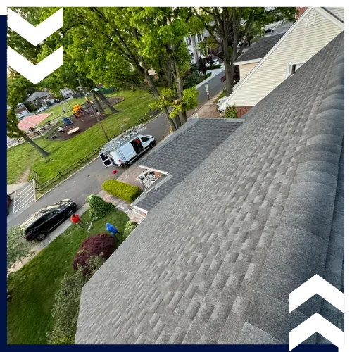 Skilled roof installers in White Plains, NY completing a residential project.