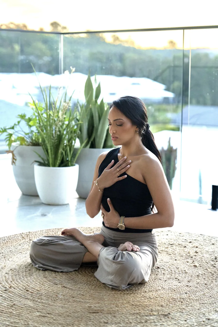Saddy meditating, hand on her heart