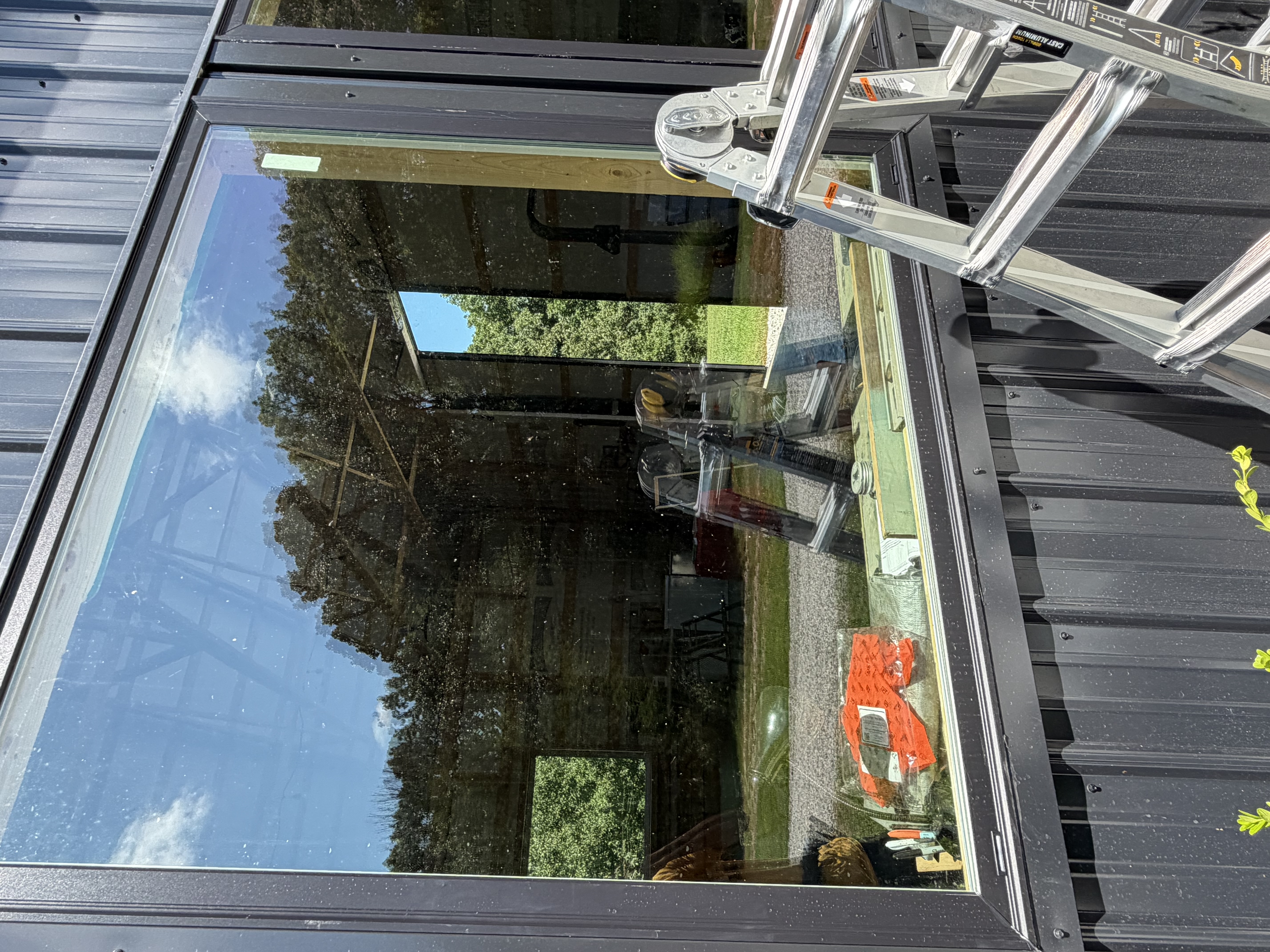 Clean home windows reflecting daylight after a hand clean.