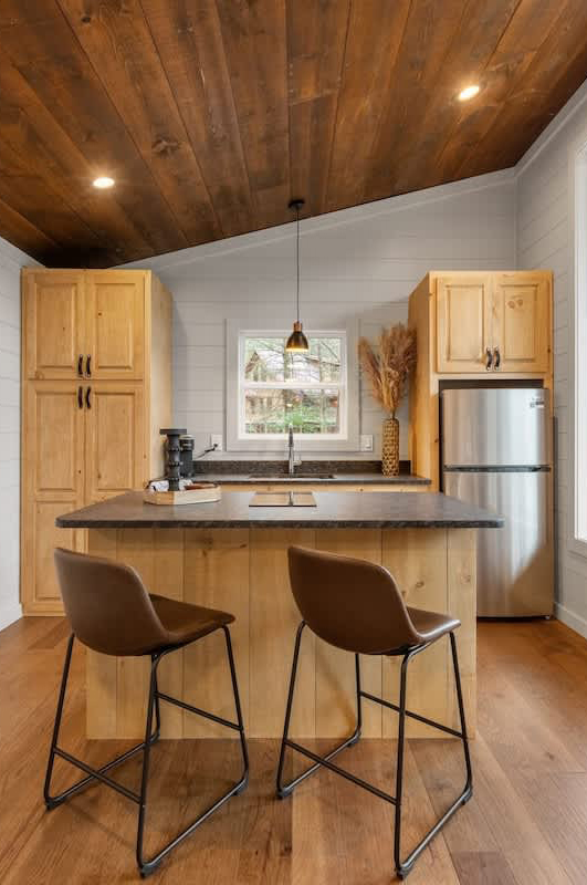 woman setting sheets on bed