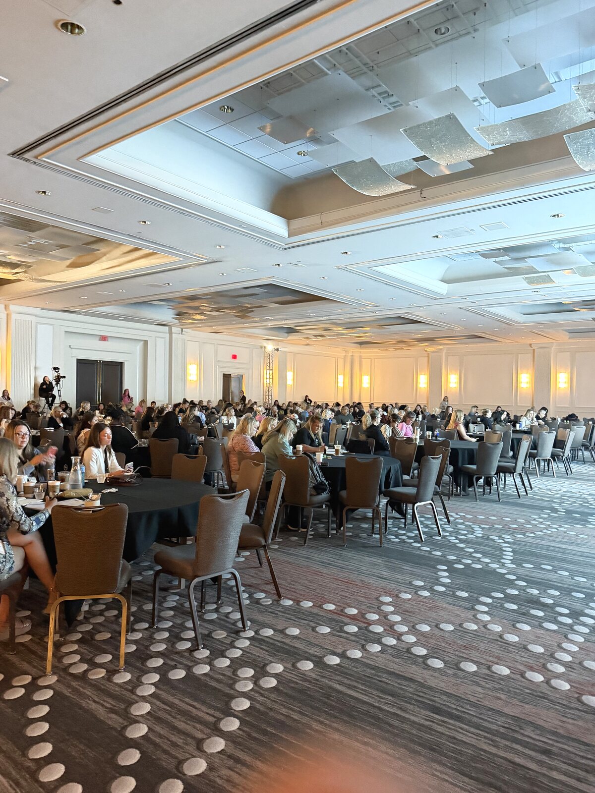 Full conference ballroom audience