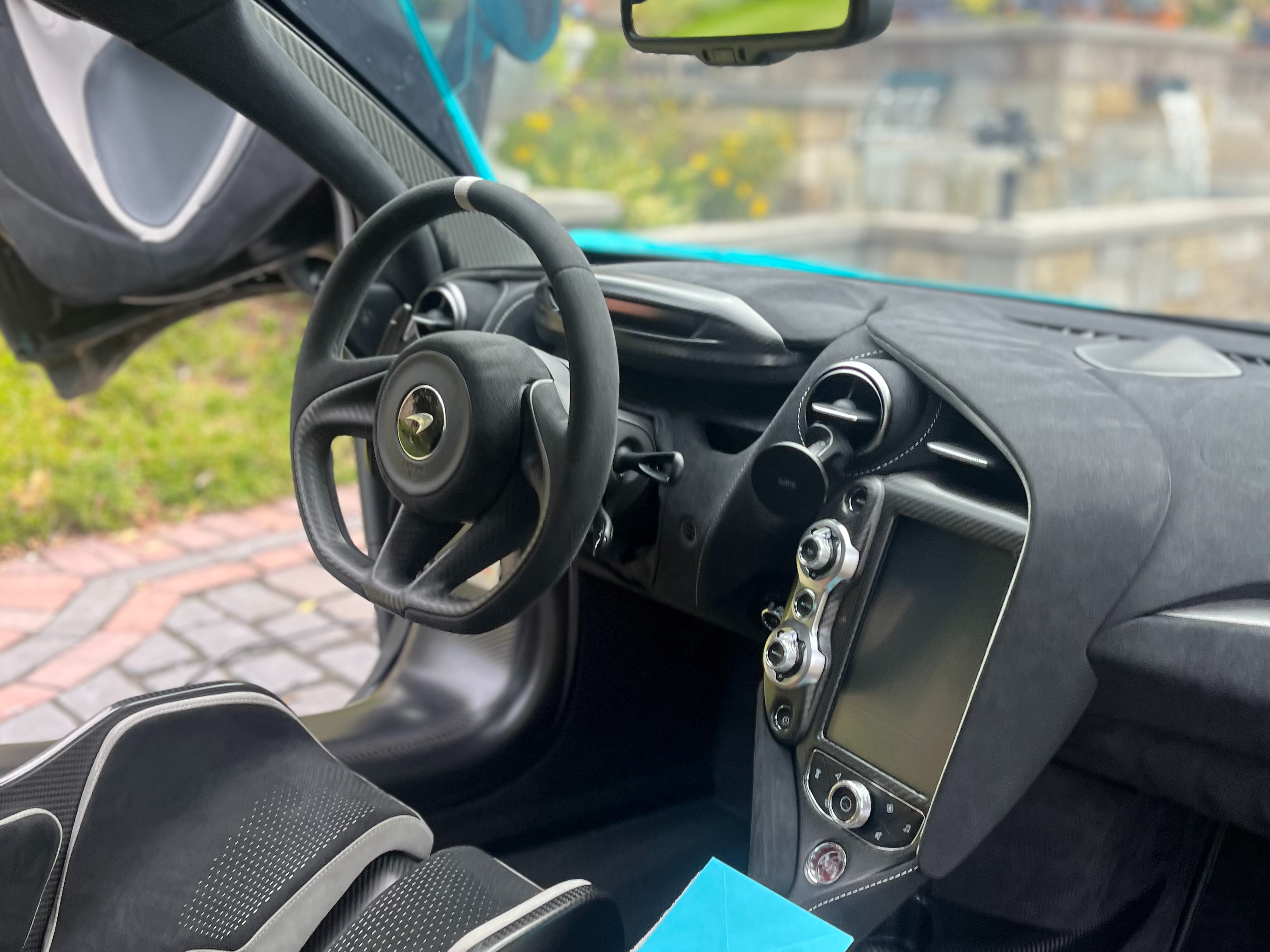 Red sports car paint correction mirror finish