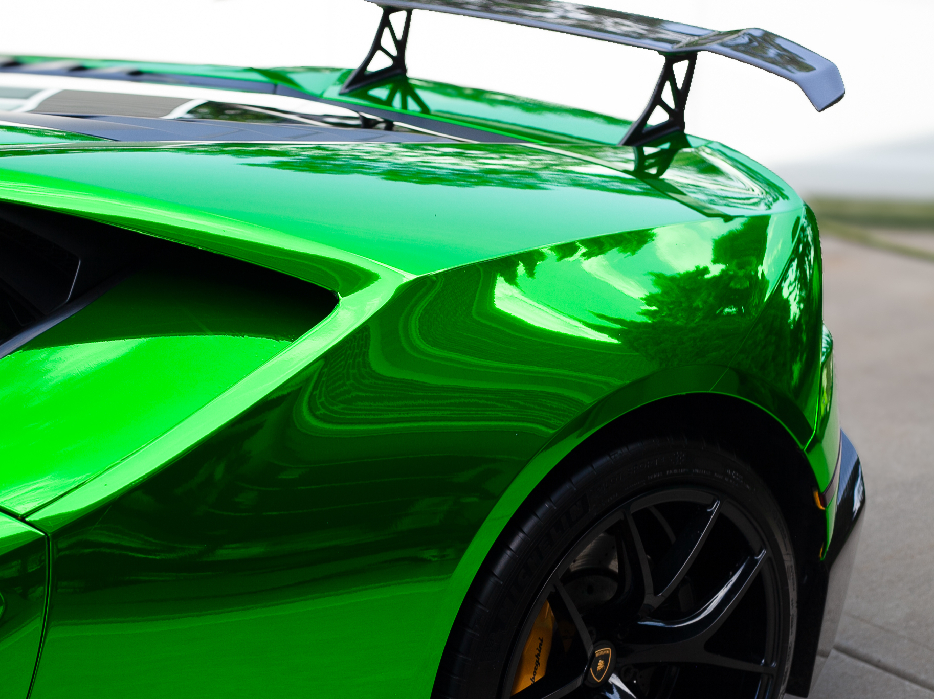 Ceramic coating being applied to hood