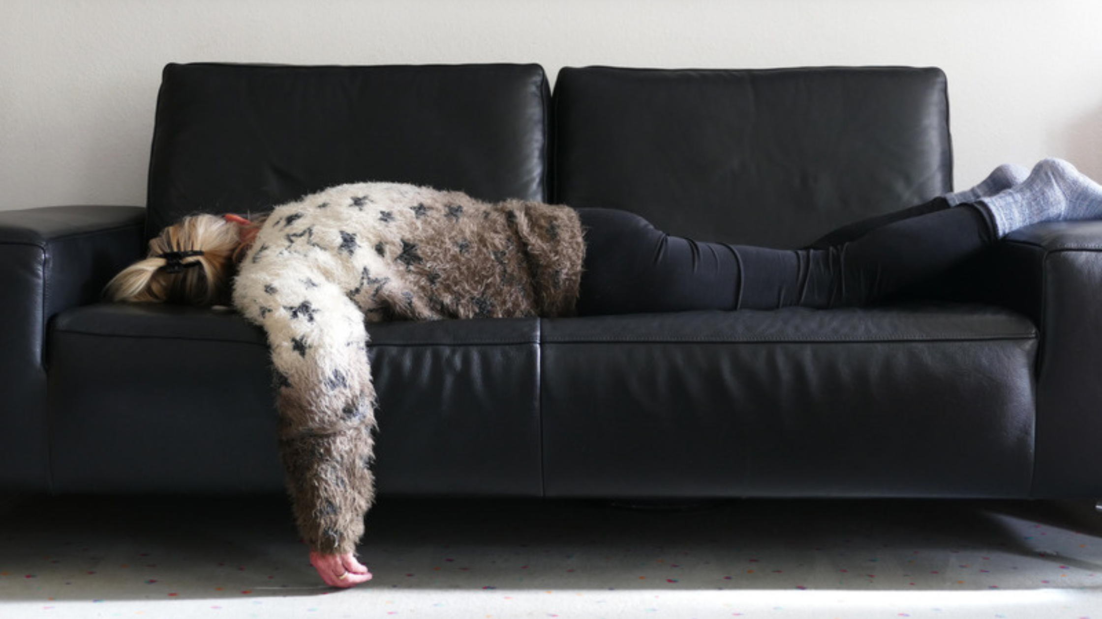 woman lying on a couch woman lying on a couch